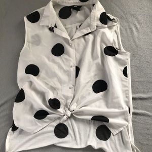 Black and white sleeveless blouse.